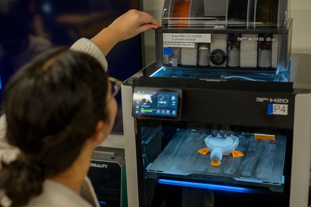 A student using a 3D printer